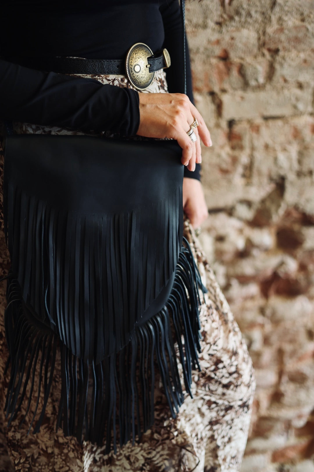 Natalia’s black leather fringe bag